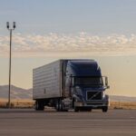 US map showing states people are leaving in 2026, migration truck on highway